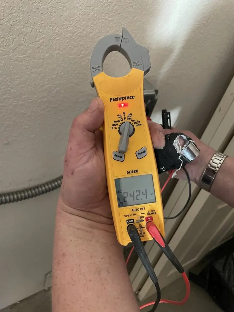 Voltage testing with clamp meter during Electrical Installation Services in Walpole